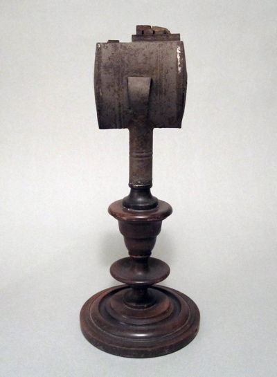 This unusual early American lard oil lamp is made of tin and measures 14″ 
